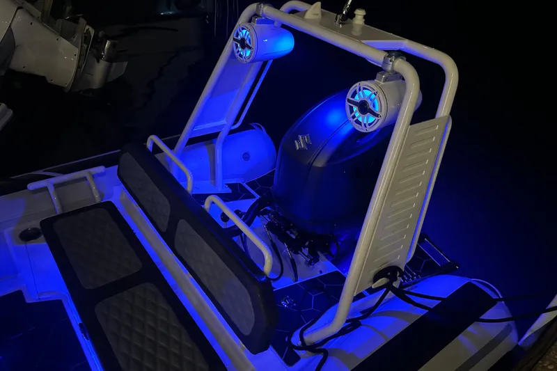Slide: The Image of 2025 Highfield Sport 660 boat interior with blue LED lighting and modern seating. - 11
