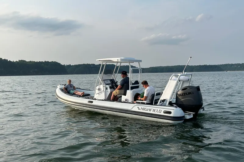 Slide: The Image of 2025 Highfield Sport 660 boat on water with passengers, featuring Suzuki outboard motor. - 13