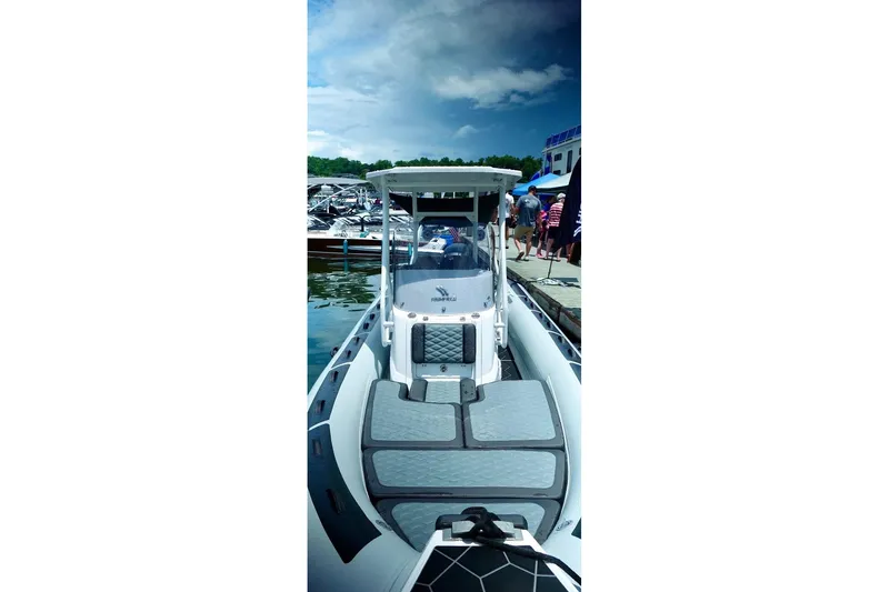 Slide: The Image of 2025 Highfield Sport 660 boat docked, showcasing sleek design and spacious deck. - 4