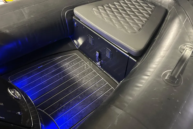 Slide: The Image of 2025 Highfield Sport 360 boat interior with quilted seat and illuminated flooring. - 13