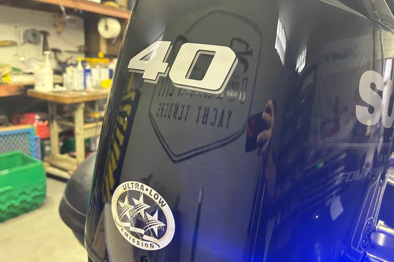 Slide: The Image of Close-up of a 2025 Highfield Sport 360 outboard motor with "40" and "Ultra Low Emission" labels. - 16
