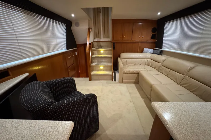 Slide: The Image of Luxurious interior of 2000 Carver 406 Aft Cabin Motor Yacht with plush seating and elegant design. - 14