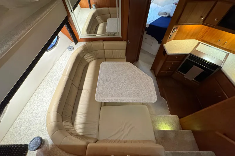 Slide: The Image of Interior of 2000 Carver 406 Aft Cabin Motor Yacht with dining area and kitchen. - 20
