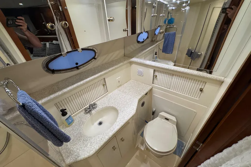 Slide: The Image of Bathroom of 2000 Carver 406 Aft Cabin Motor Yacht with sink, toilet, and mirror. - 25