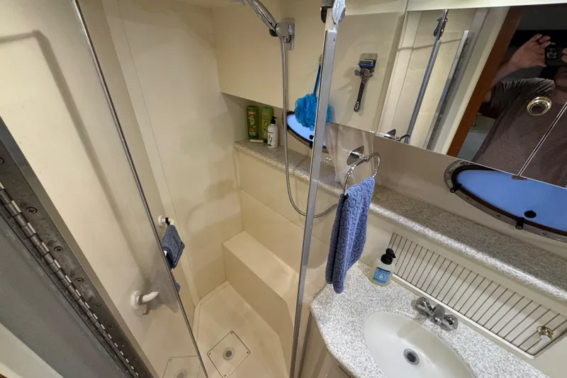Slide: The Image of Bathroom interior of 2000 Carver 406 Aft Cabin Motor Yacht with shower and sink. - 26