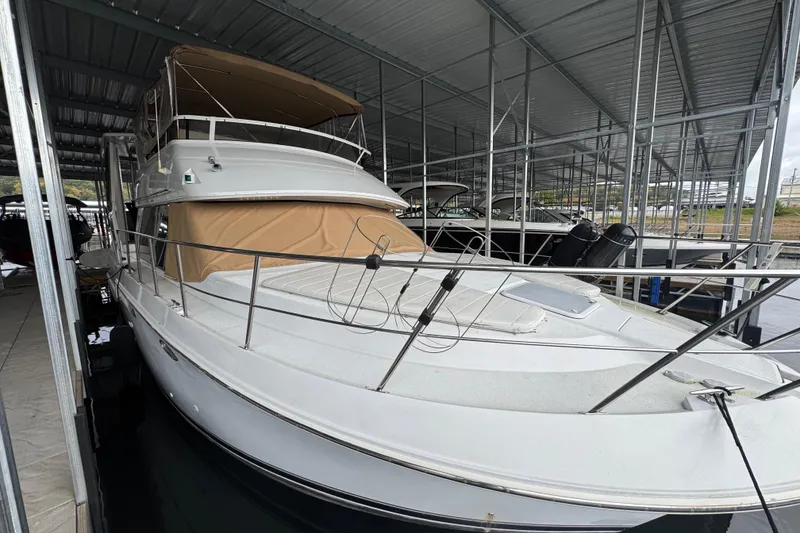 Slide: The Image of 2000 Carver 406 Aft Cabin Motor Yacht docked in covered marina. - 6