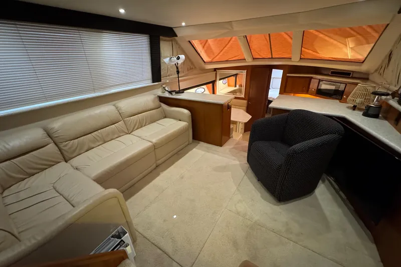 Slide: The Image of Luxurious interior of 2000 Carver 406 Aft Cabin Motor Yacht with plush seating and modern amenities. - 17