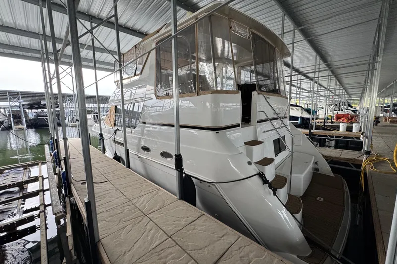 Slide: The Image of 2000 Carver 406 Aft Cabin Motor Yacht docked in covered marina. - 4