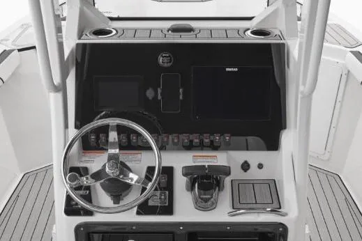 Slide: The Image of 2022 Yamaha Boats 255 FSH Sport E dashboard with steering wheel and controls. - 14