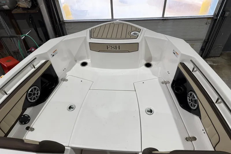 Slide: The Image of 2022 Yamaha Boats 255 FSH Sport E interior, featuring spacious seating and modern design. - 7