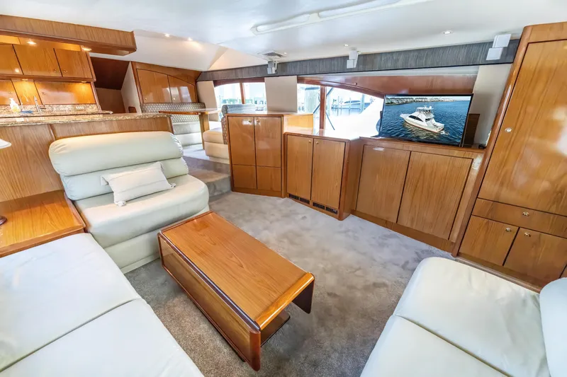 Slide: The Image of Luxurious 2006 Ocean 57 yacht interior with elegant wood finishes and comfortable seating. - 14