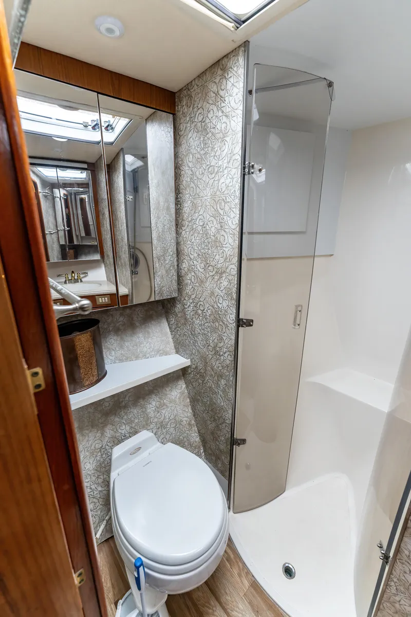 Slide: The Image of Luxurious 2006 Ocean 57 yacht bathroom with modern fixtures and elegant design. - 27