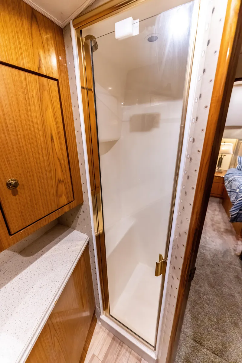 Slide: The Image of Luxurious bathroom shower in 2006 Ocean 57 yacht with wooden cabinetry. - 36