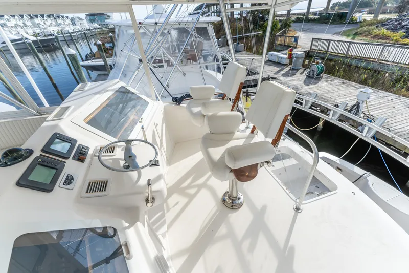 Slide: The Image of 2006 Ocean 57 yacht helm with dual captain chairs and navigation equipment. - 43