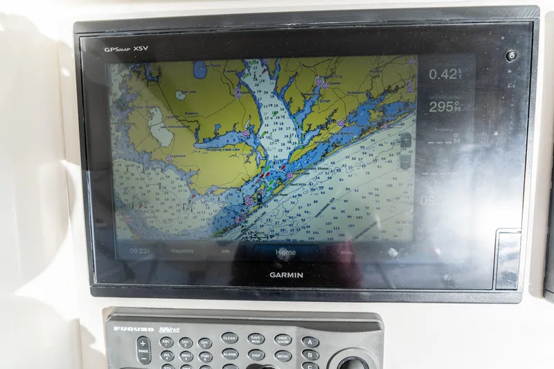 Slide: The Image of Garmin GPS display on 2006 Ocean 57 yacht, showing nautical map and navigation controls. - 49