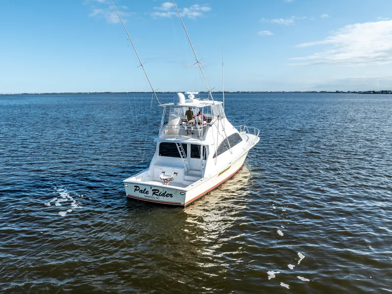 Slide: The Image of Ocean 57 yacht from 2006 on open water, clear sky background. - 6
