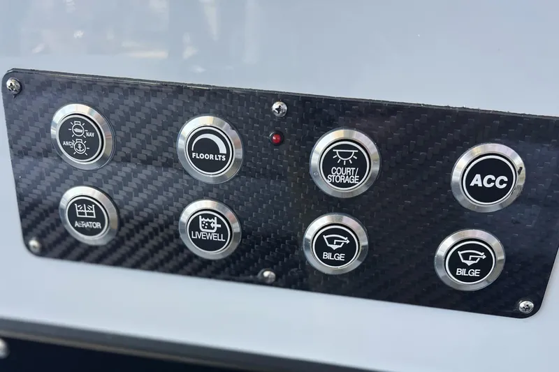 Slide: The Image of Control panel of 2026 Chittum Skiffs 21 Islamorada with various function buttons. - 18