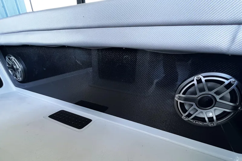 Slide: The Image of 2026 Chittum Skiffs 21 Islamorada interior with carbon fiber panel and speakers. - 19