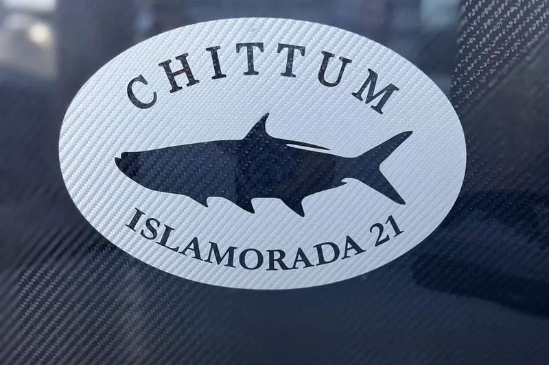 Slide: The Image of Sticker of Chittum Skiffs 2026 Islamorada 21 with shark silhouette. - 23