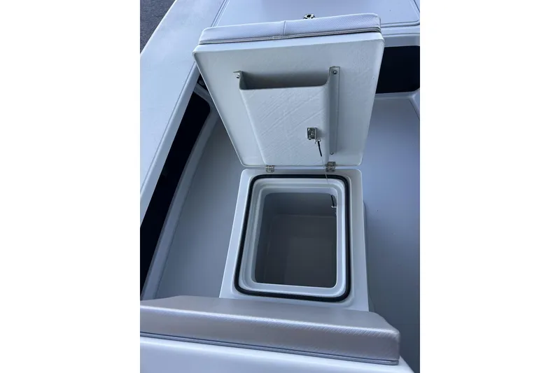 Slide: The Image of Open storage compartment on 2026 Chittum Skiffs 21 Islamorada boat. - 24