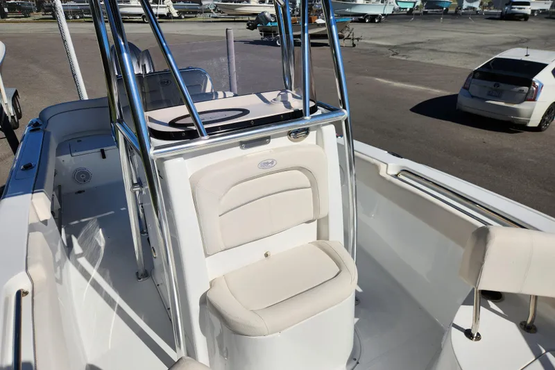 Slide: The Image of 2024 Sea Hunt Ultra 229 boat interior with seating and chrome details. - 9