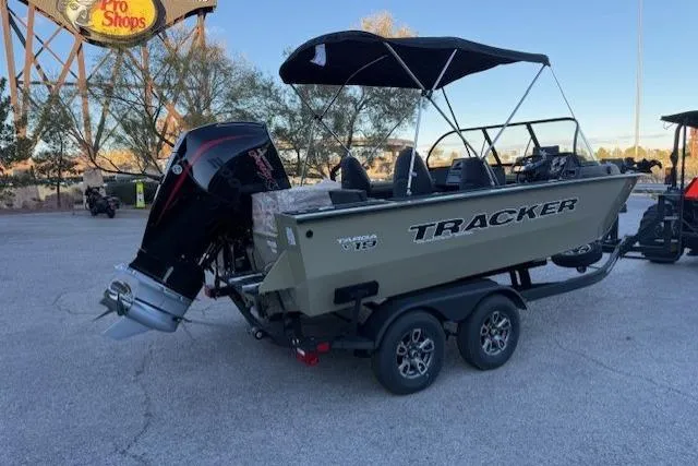Slide: The Image of 2026 Tracker Targa V-19 Combo boat on trailer, parked outdoors. - 10