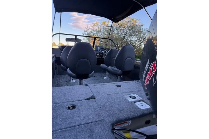 Slide: The Image of 2026 Tracker Targa V-19 Combo boat interior with seating and steering console. - 3