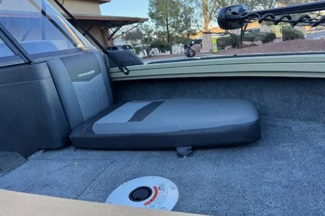 Slide: The Image of 2026 Tracker Targa V-19 Combo boat interior with green navigation light and water bottle. - 8