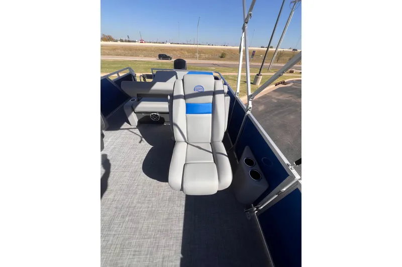Slide: The Image of 2026 Sun Tracker Party Barge 22 RF DLX interior with seating and cup holders. - 10