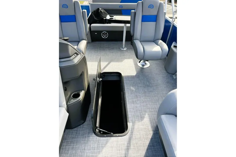 Slide: The Image of 2026 Sun Tracker Party Barge 22 RF XP3 interior with open storage compartment and seating. - 15