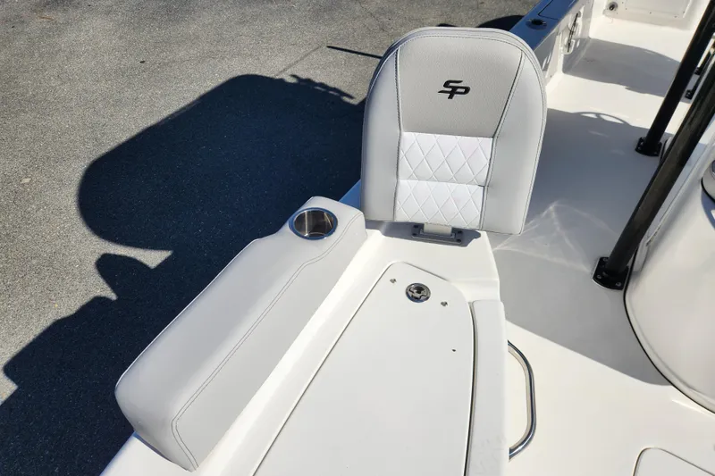 Slide: The Image of 2019 Sea Pro 248 Bay boat seat with cup holder and storage compartment. - 12