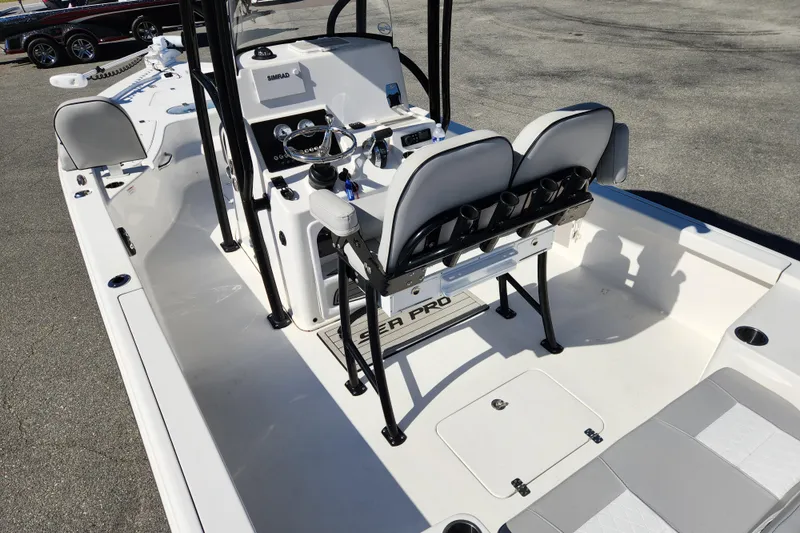 Slide: The Image of 2019 Sea Pro 248 Bay boat interior with dual seats and steering console. - 16
