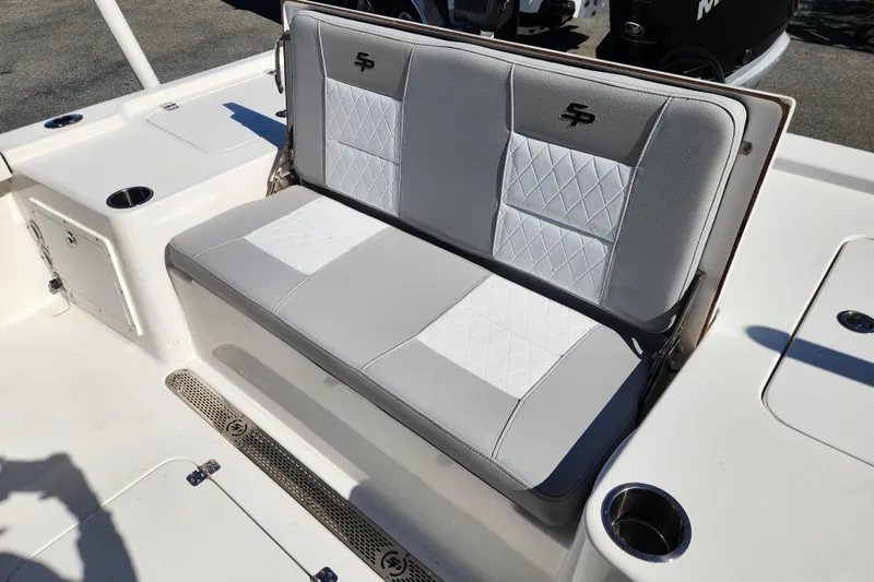 Slide: The Image of 2019 Sea Pro 248 Bay boat with cushioned seating and cup holders. - 20
