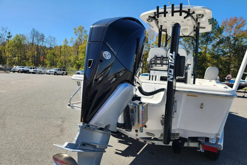 Slide: The Image of 2019 Sea Pro 248 Bay boat with powerful outboard motor in a parking lot. - 4