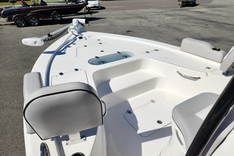 Slide: The Image of 2019 Sea Pro 248 Bay boat interior with seating and storage compartments. - 9