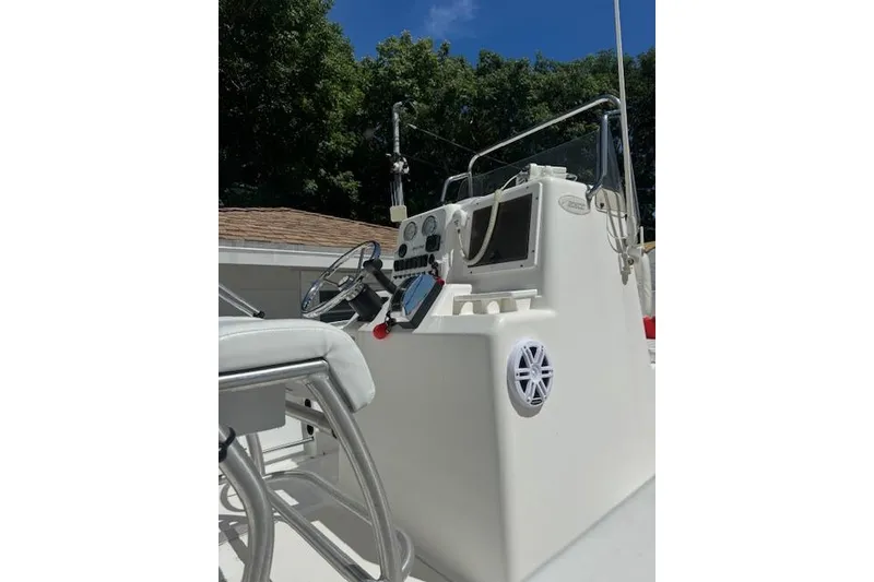 Slide: The Image of 2003 Sea Pro 206 Center Console boat dashboard with steering wheel and controls. - 6