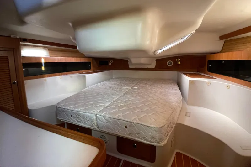 Slide: The Image of Interior cabin of a 2001 Catalina 380 sailboat with a comfortable bed. - 10