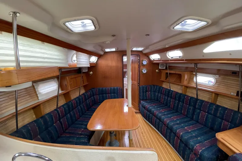 Slide: The Image of Interior of 2001 Catalina 380 sailboat kitchen with stove, microwave, and sink. - 5