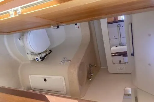 Slide: The Image of Interior of 2001 Catalina 380 sailboat with wood finish and cozy seating area. - 9