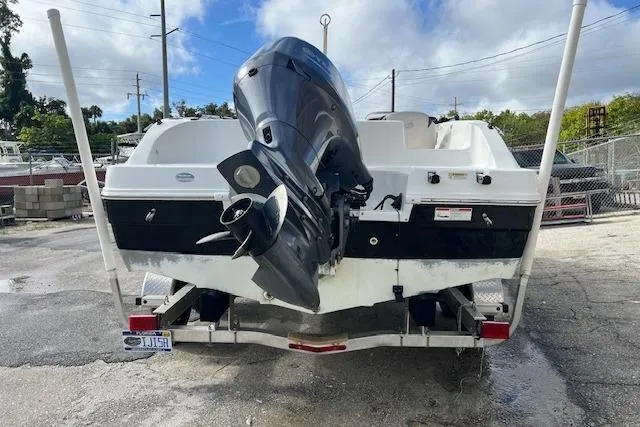 Slide: The Image of 2017 Hurricane SunDeck Sport 188 OB boat on trailer, rear view with outboard motor. - 1