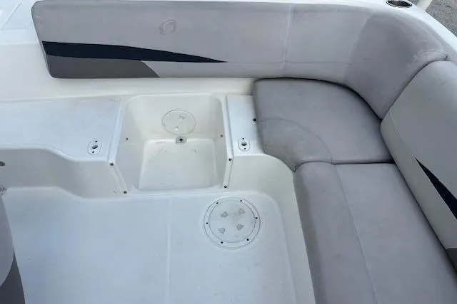 Slide: The Image of 2017 Hurricane SunDeck Sport 188 OB boat interior with gray seating and steering area. - 2