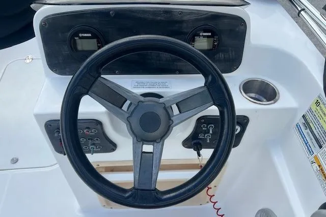 Slide: The Image of 2017 Hurricane SunDeck Sport 188 OB boat interior with gray cushioned seating. - 5