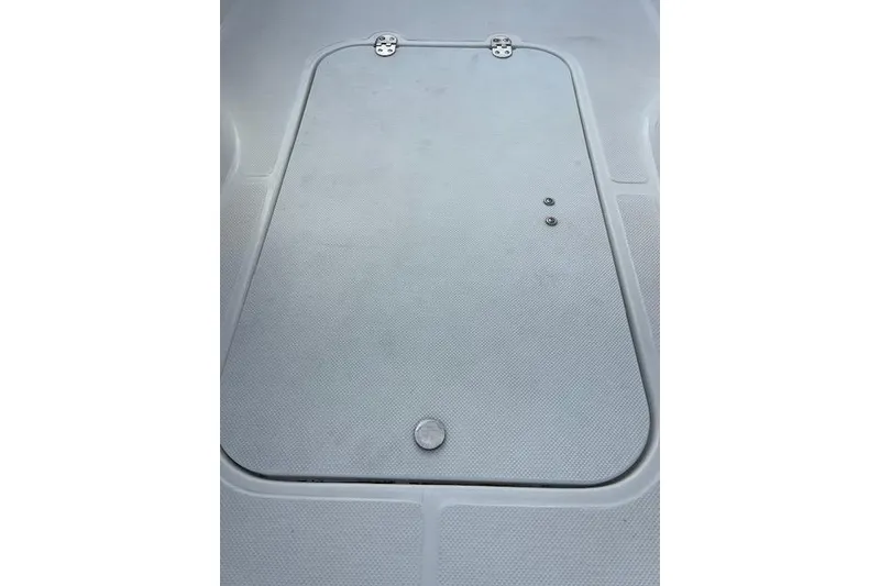 Slide: The Image of 2017 Hurricane SunDeck Sport 188 OB boat storage compartment with latch. - 6