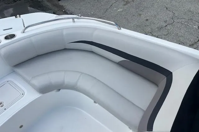 Slide: The Image of 2017 Hurricane SunDeck Sport 188 OB boat interior with cushioned seating and cup holders. - 9