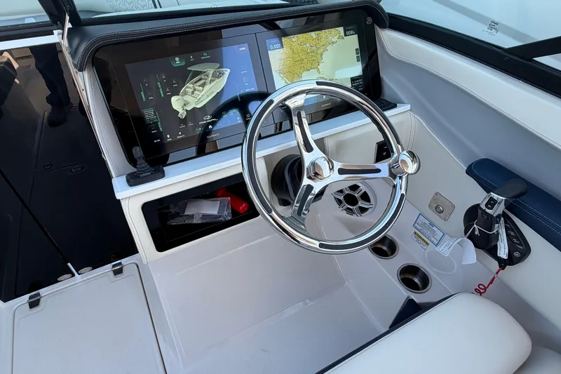 Slide: The Image of 2026 Regal LX6 boat interior with compact marine toilet and storage space. - 26