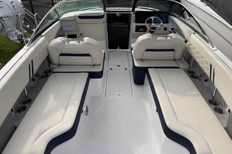 Slide: The Image of 2026 Regal LX6 boat interior with modern dashboard and seating. - 30