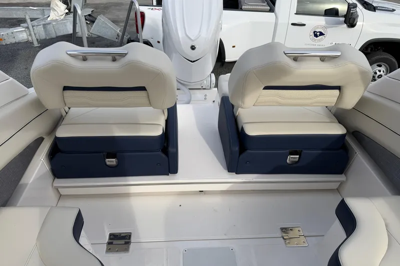 Slide: The Image of 2026 Regal LX6 boat interior with luxurious seating and modern design. - 32