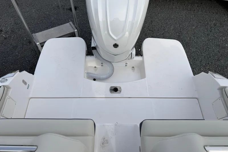 Slide: The Image of 2026 Regal LX6 boat interior with luxurious seating and cup holders. - 34