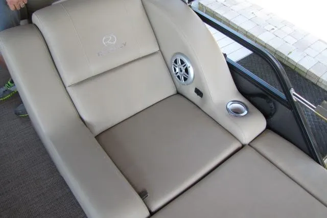 Slide: The Image of Luxurious seating on 2018 Regency 220 DL3 boat with speaker and cup holder. - 6