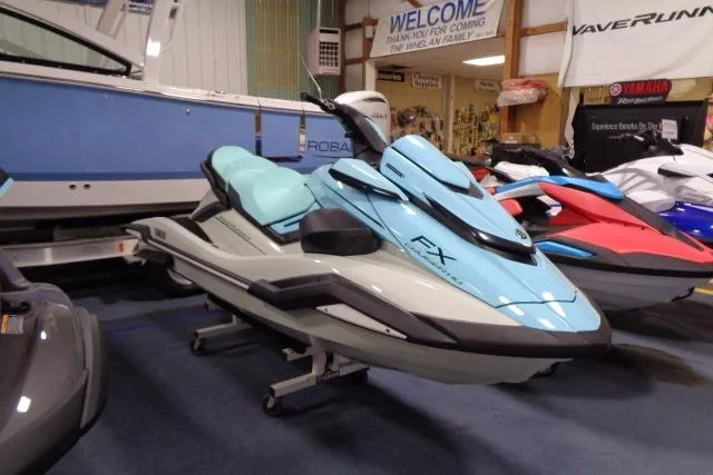 Slide: The Image of 2025 Yamaha WaveRunner FX Cruiser HO in showroom, light blue color, side view. - 3
